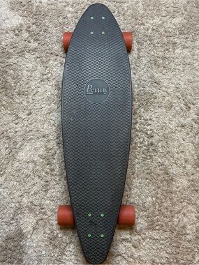 Black Cruiser Skateboard with Red Wheels
